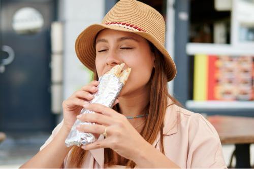 Girl eating a burrito
