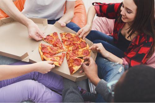 Students enjoying pizza