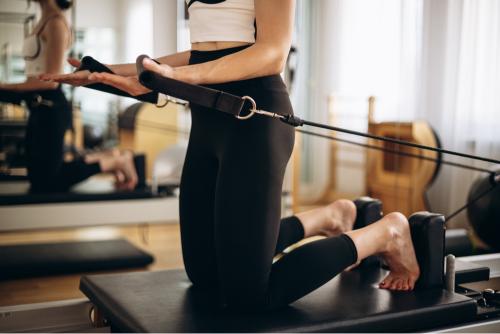 Girl doing reformer pilates